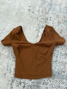orange/brown lululemon top! Never worn.